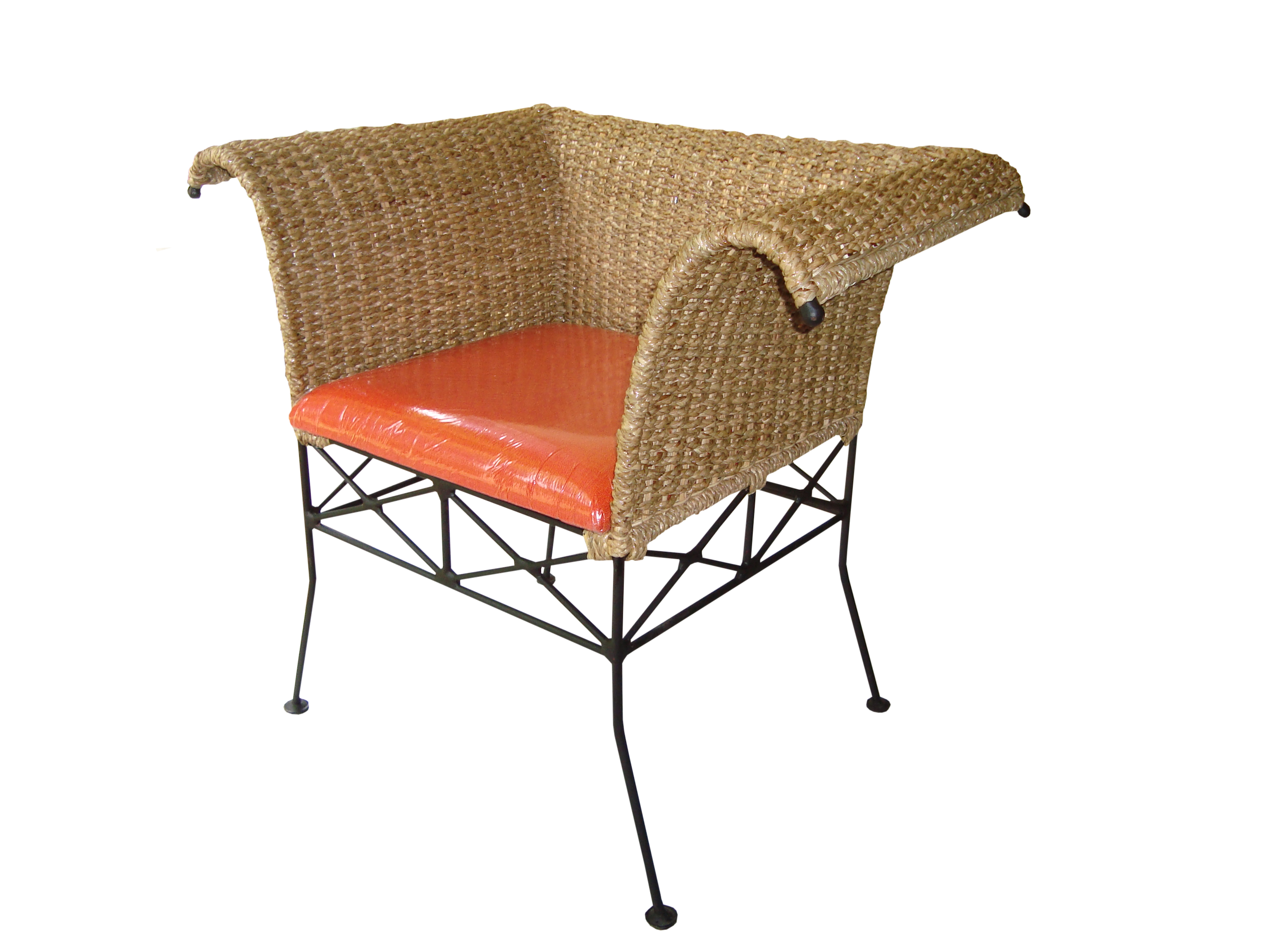 Single seater sofa with an orange cushion made of cane on three sides and wrough iron legs